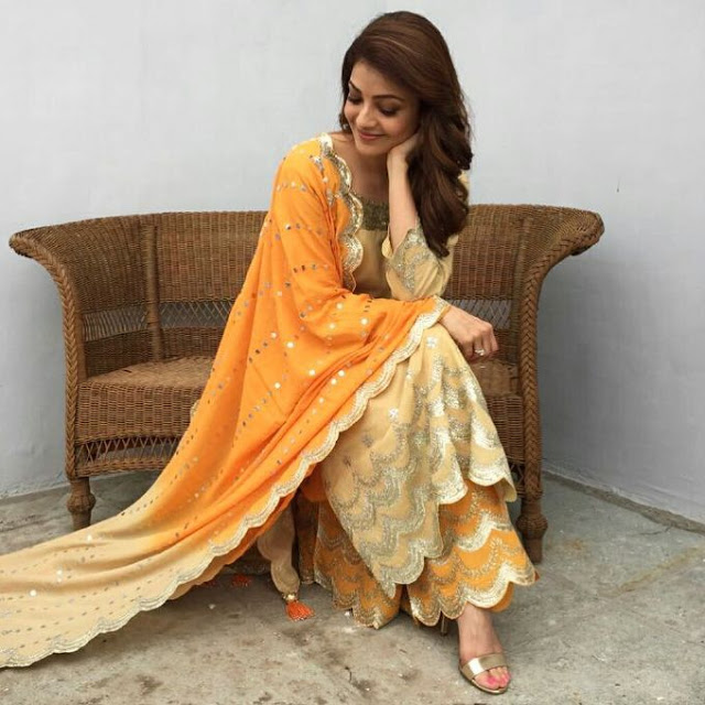Kajal Aggarwal Stills In Yellow Dress Looking Cute 16