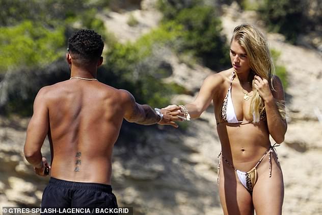 Love Island’s Arabella Chi stuns the fans with her suntanned skin in a tiny bikini as she spends time with Josh Newsham 77
