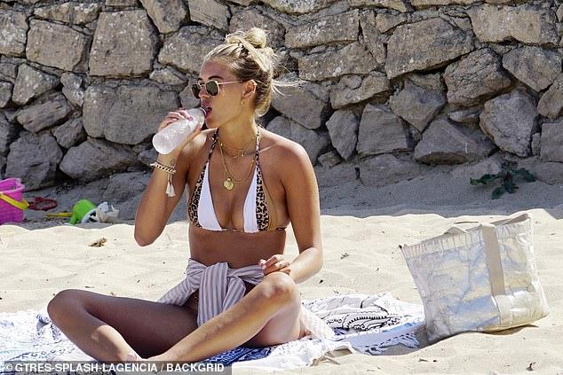 Love Island’s Arabella Chi stuns the fans with her suntanned skin in a tiny bikini as she spends time with Josh Newsham 71