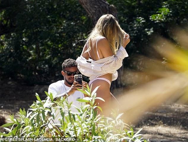 Love Island’s Arabella Chi stuns the fans with her suntanned skin in a tiny bikini as she spends time with Josh Newsham 49