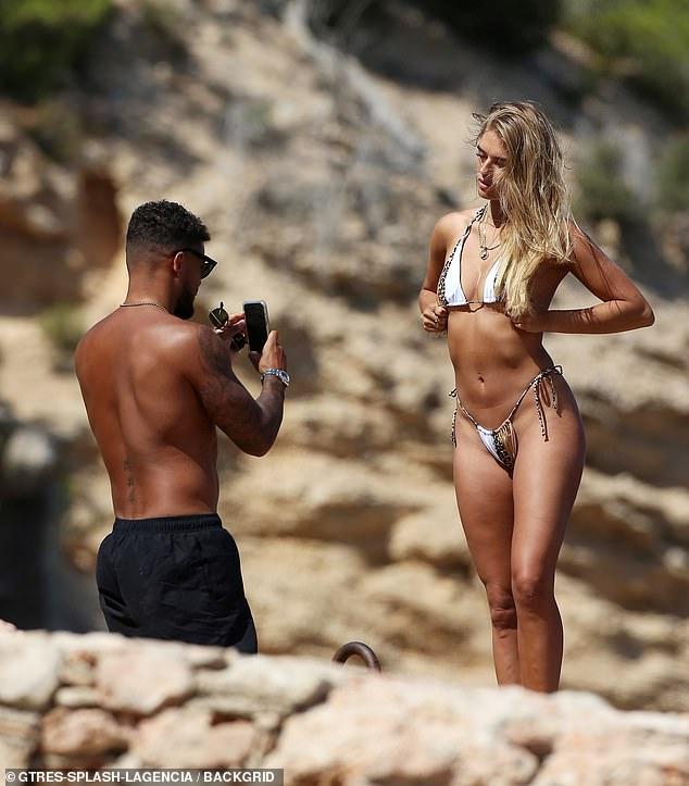 Love Island’s Arabella Chi stuns the fans with her suntanned skin in a tiny bikini as she spends time with Josh Newsham 84
