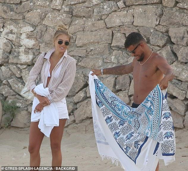 Love Island’s Arabella Chi stuns the fans with her suntanned skin in a tiny bikini as she spends time with Josh Newsham 89