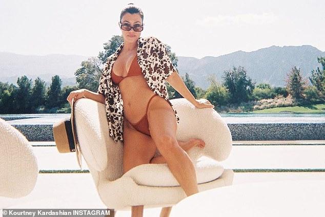 Kourtney Kardashian shows off her bomb figure in a leopard-print Good American swimsuit 138