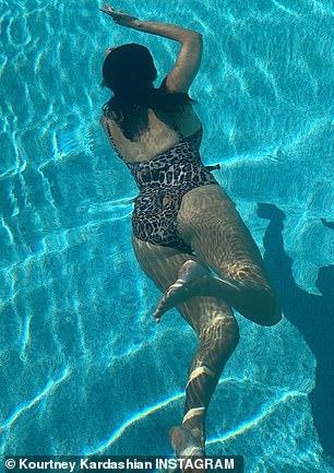 Kourtney Kardashian shows off her bomb figure in a leopard-print Good American swimsuit 6