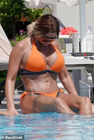 Katie Price Looks Stunning In Skimpy Orange Bikini 4