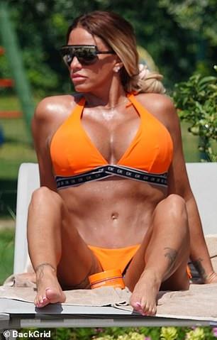 Katie Price Looks Stunning In Skimpy Orange Bikini 97