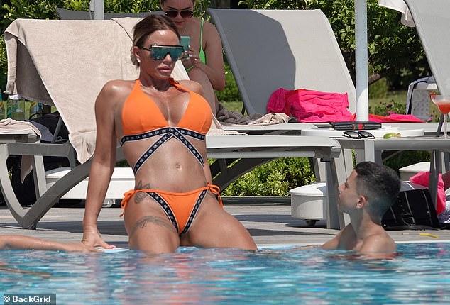 Katie Price Looks Stunning In Skimpy Orange Bikini 107