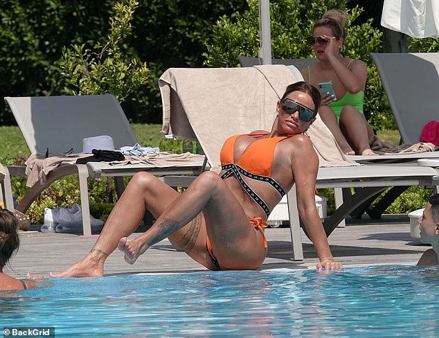 Katie Price Looks Stunning In Skimpy Orange Bikini 99