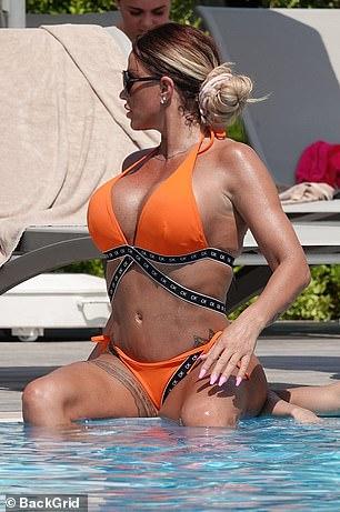Katie Price Looks Stunning In Skimpy Orange Bikini 100