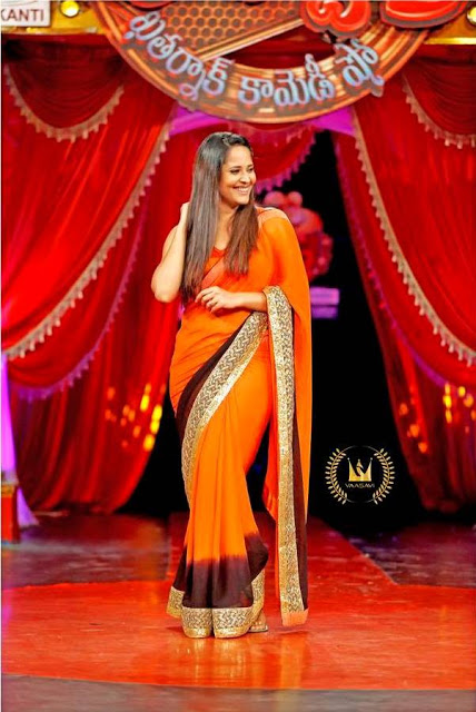 Gorgeous Indian TV Anchor Anasuya Hip Show In Orange Sari 42